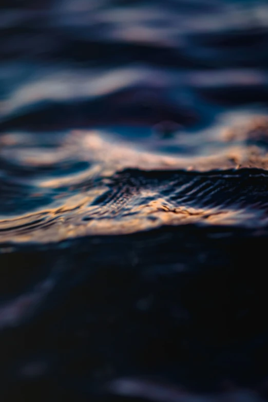 the surface of the water with ripples that are dark