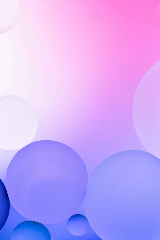 blurry abstract background with blue and white circles on pink and light blue