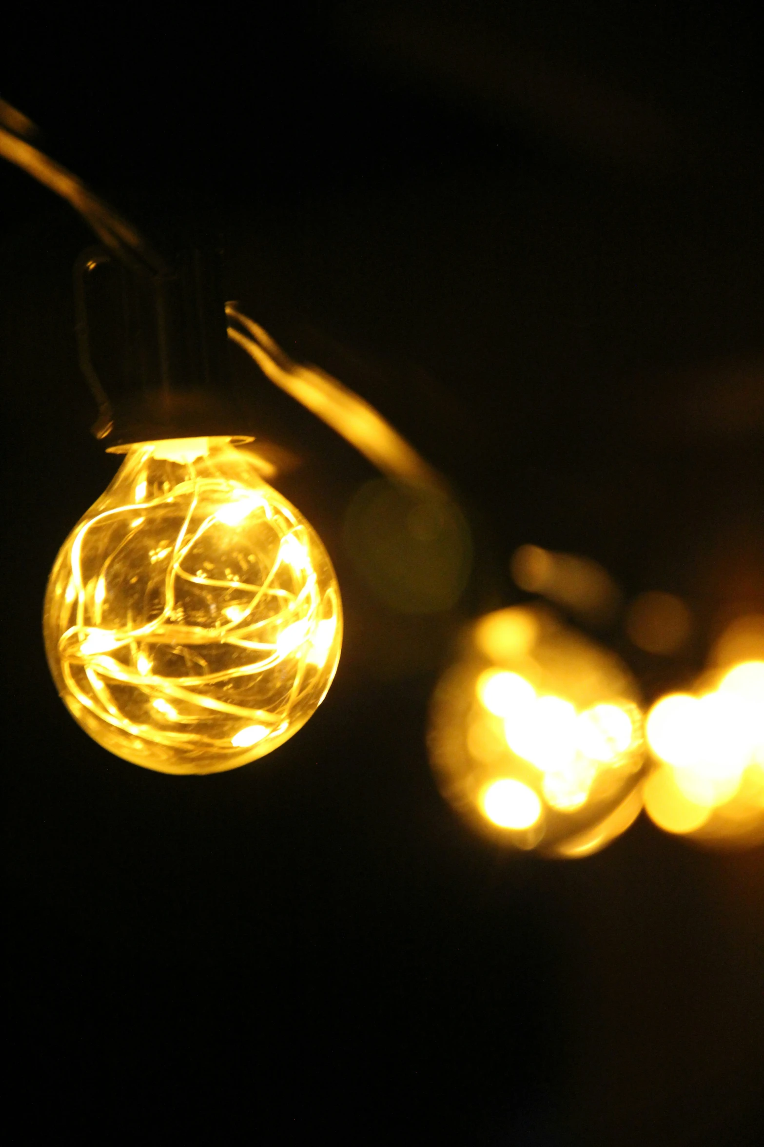 a glowing light ball sitting next to a building