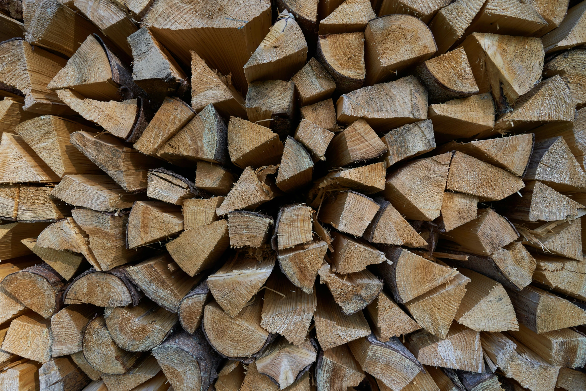 a close - up of a large pile of wood with chunks