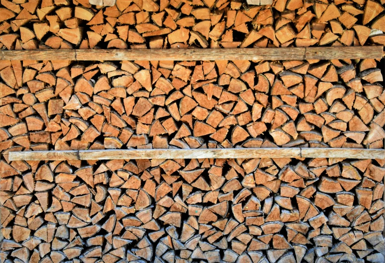 a large group of wood that is stacked on a rack