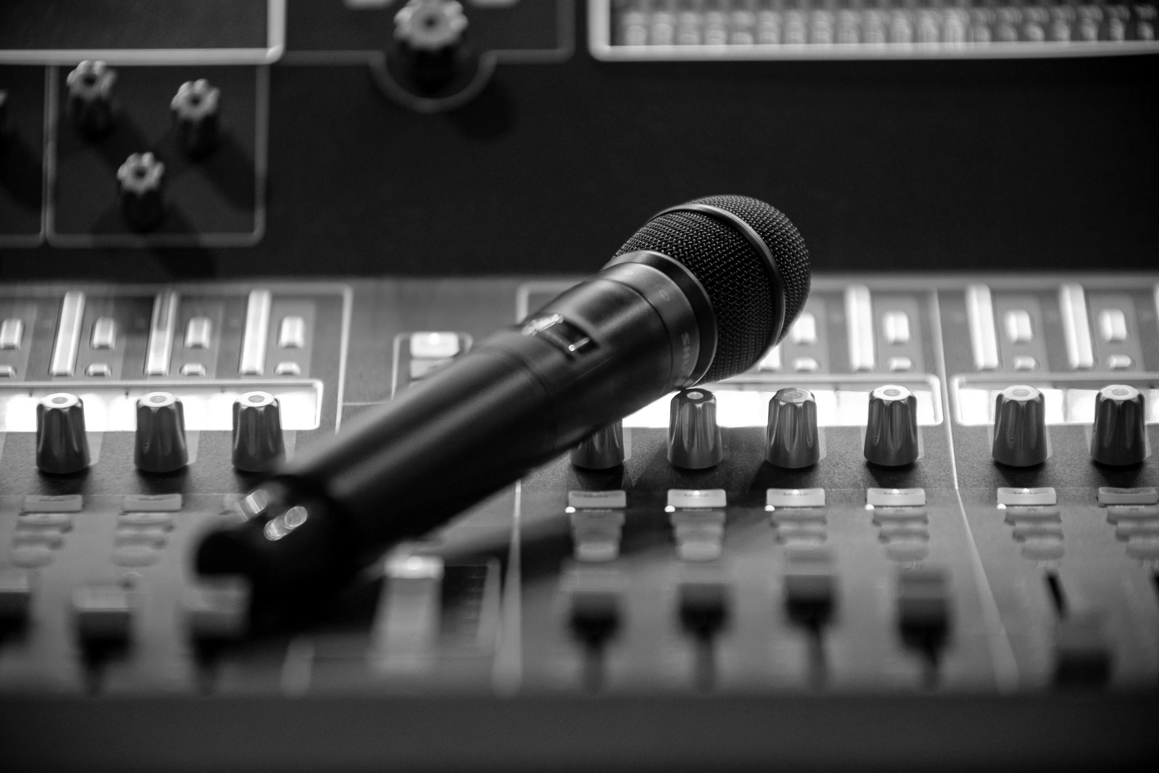 an audio sound mixing table with a microphone