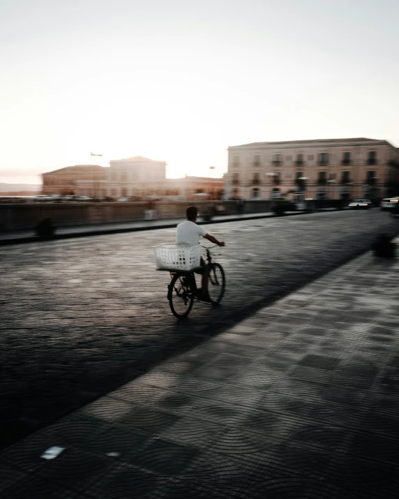 a person riding on top of a bicycle