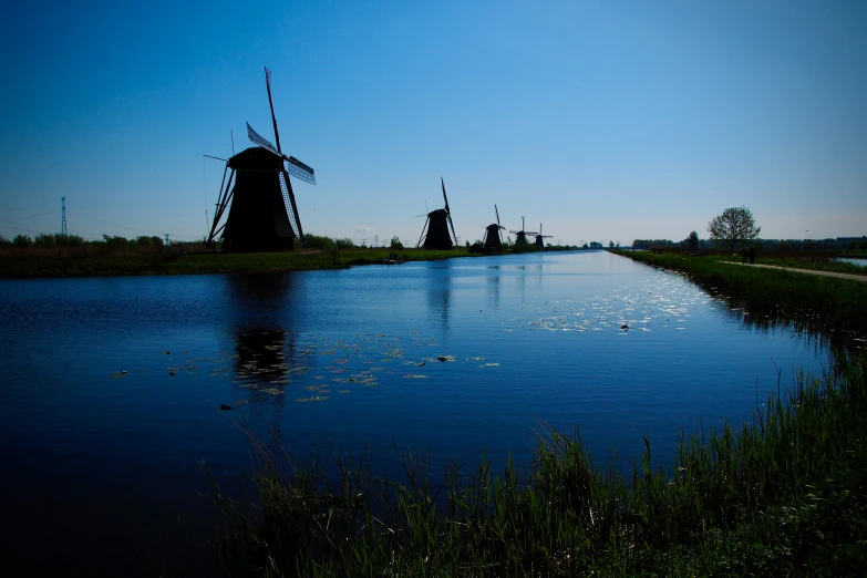 a very pretty view of some big pretty windmills