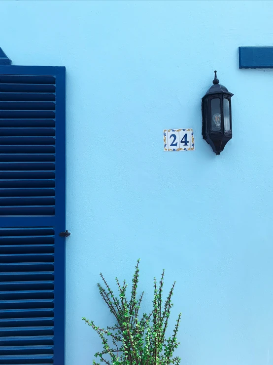 blue walls with a clock and door with shutters
