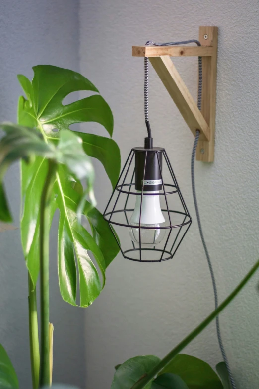 a light fixture hangs from the side of a wall