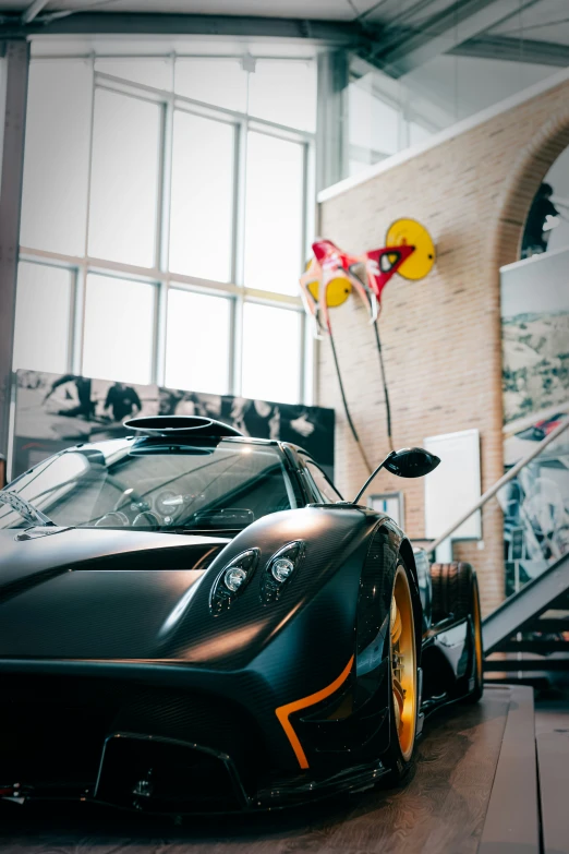 a sport car sits parked in front of a staircase