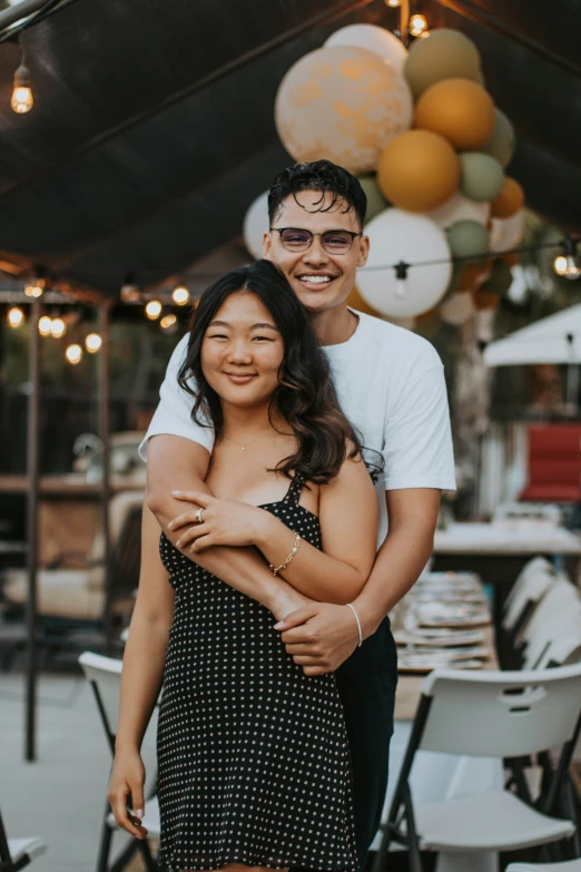 young man hugging a lady at a party