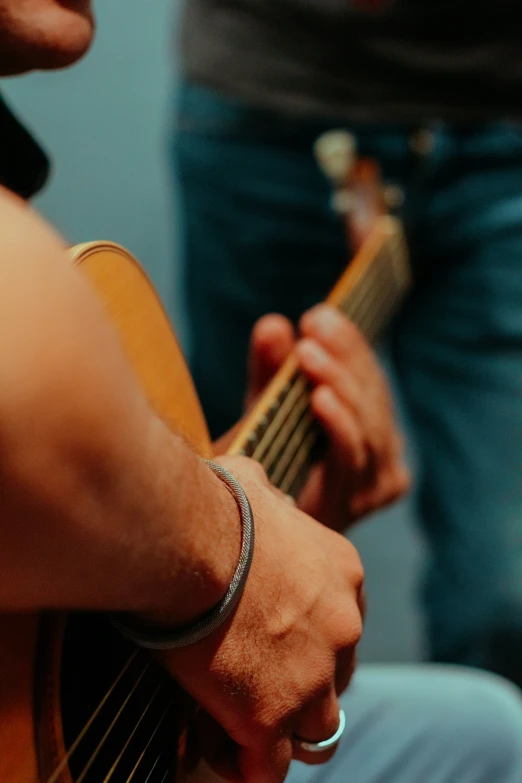 an image of a person playing guitar