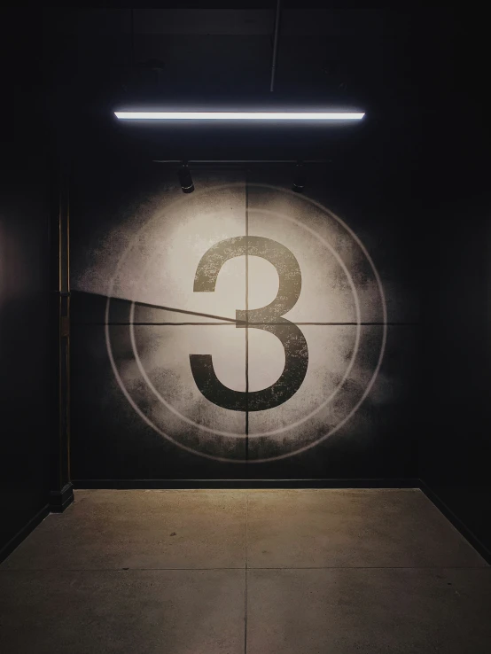 a painting of a number and its reflection on the wall
