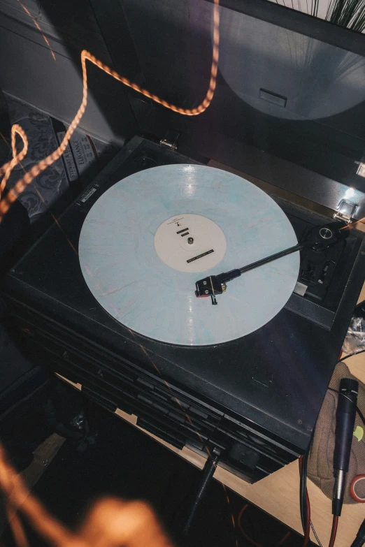 a record player with two discs in front of it