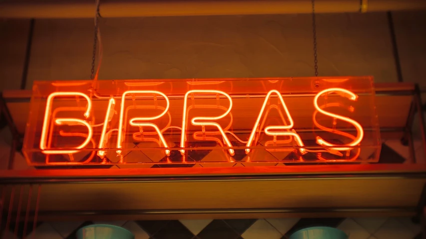 a sign for a business that reads birras