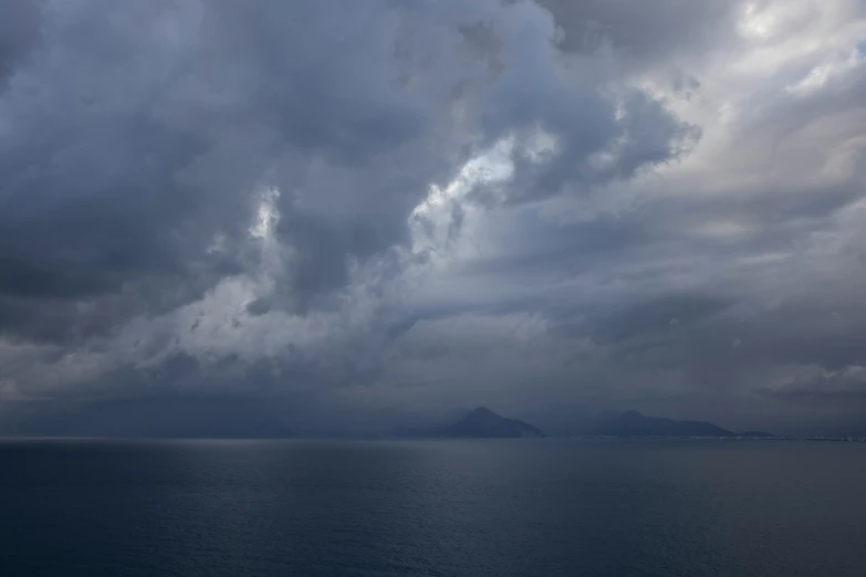 a sky filled with clouds and rain rolling in