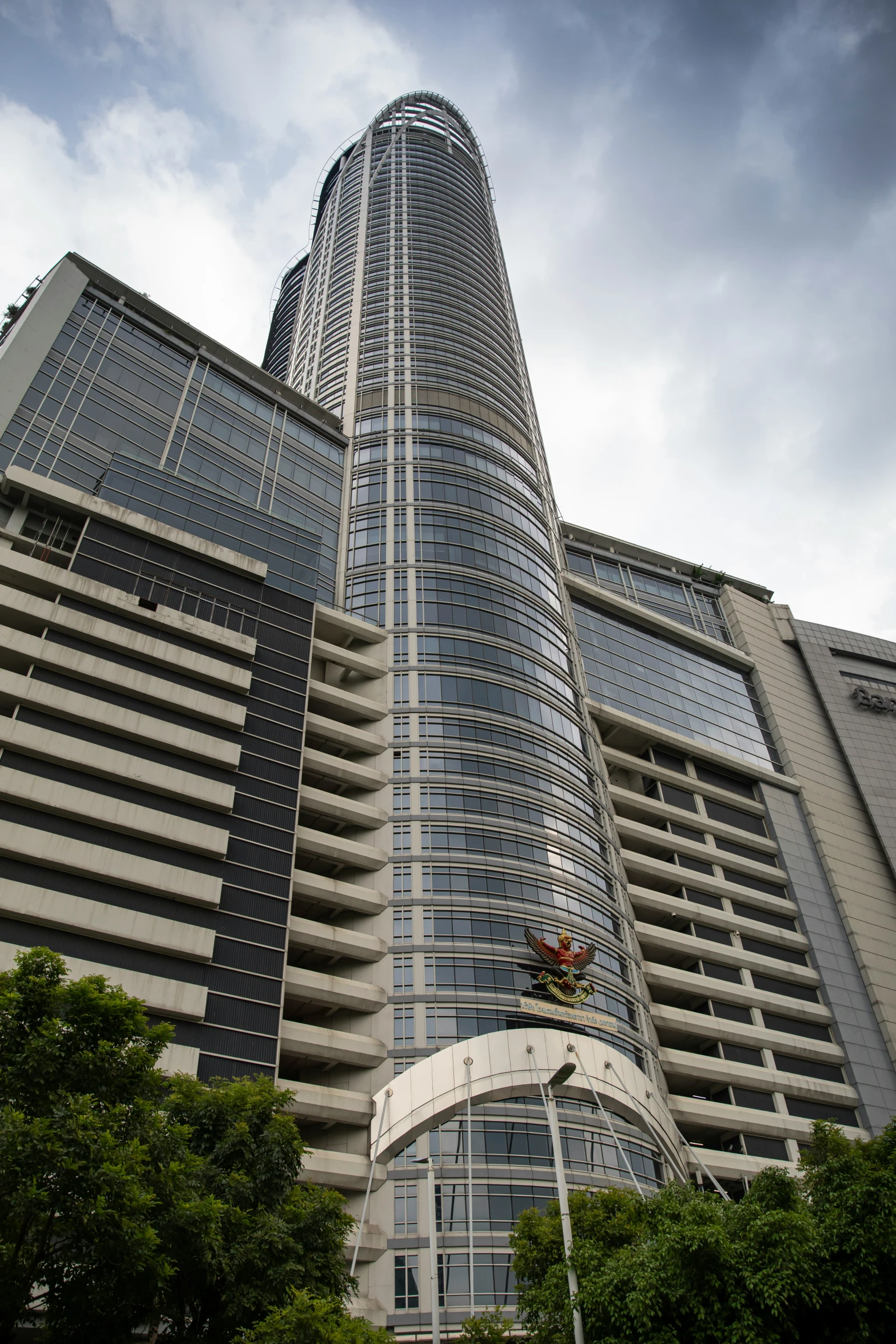 the top of a building with two trees near by