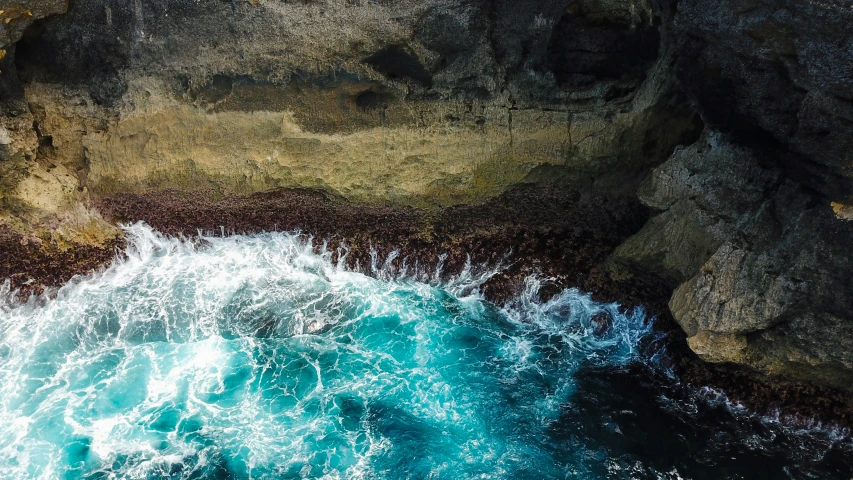 aerial view of the ocean and rocky coastline