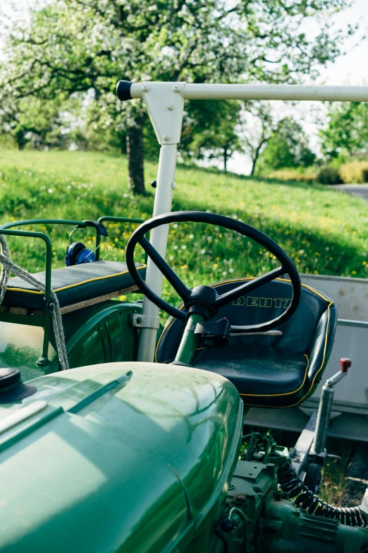 the inside of a tractor parked in the grass