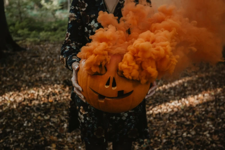 a man in an halloween costume with smoke coming out of his face