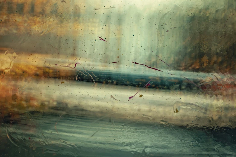 a rainy view of a wet window with leaves