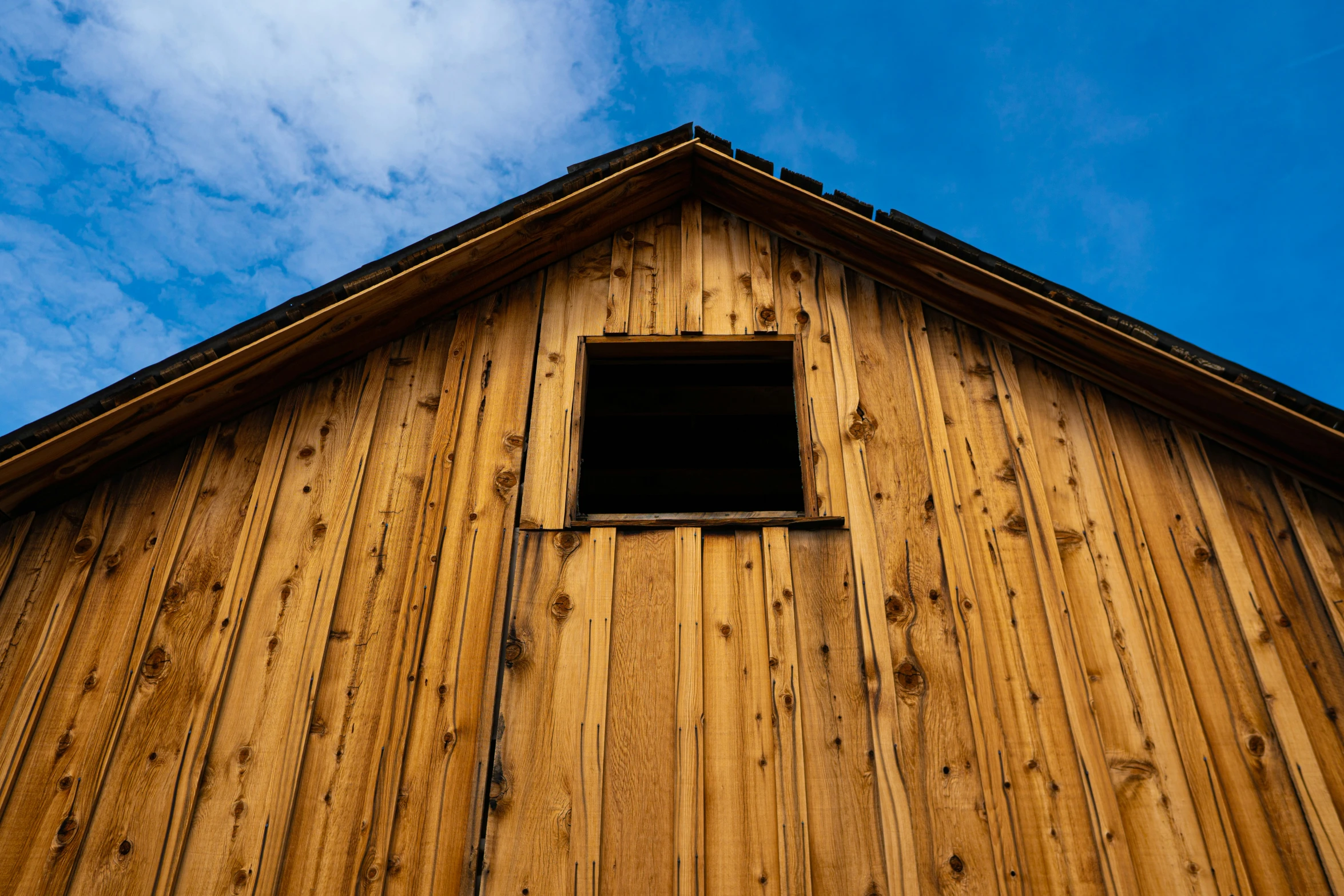 a barn that has some kind of wooden window