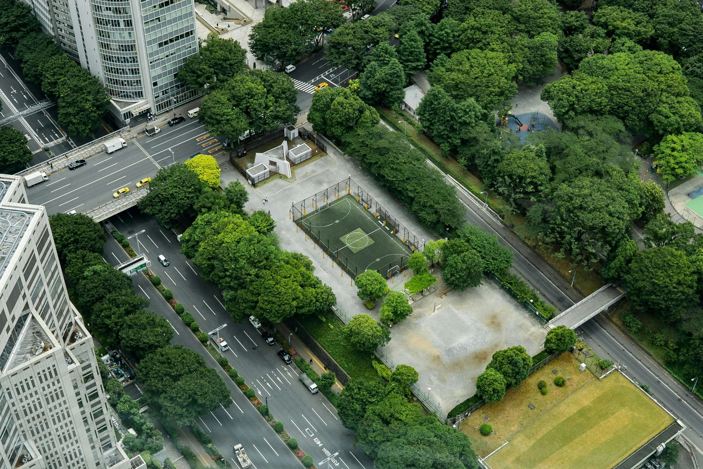 an aerial view of a cityscape shows the parking and the buildings