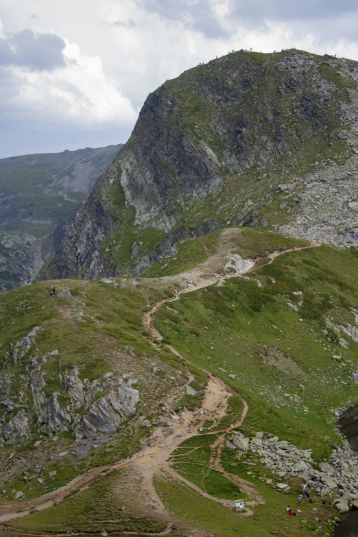 a very tall hill with a dirt path going between it