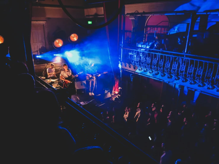 an overhead s of concert stage lights and smoke