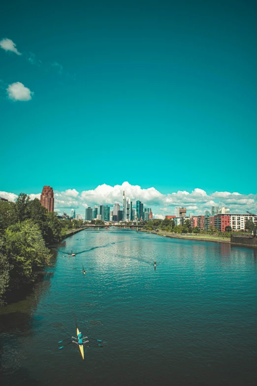 two people are paddling their kayaks on the river