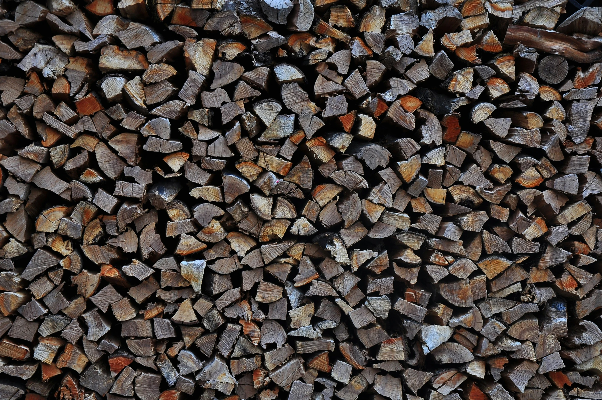 the wood is piled up in a large pile