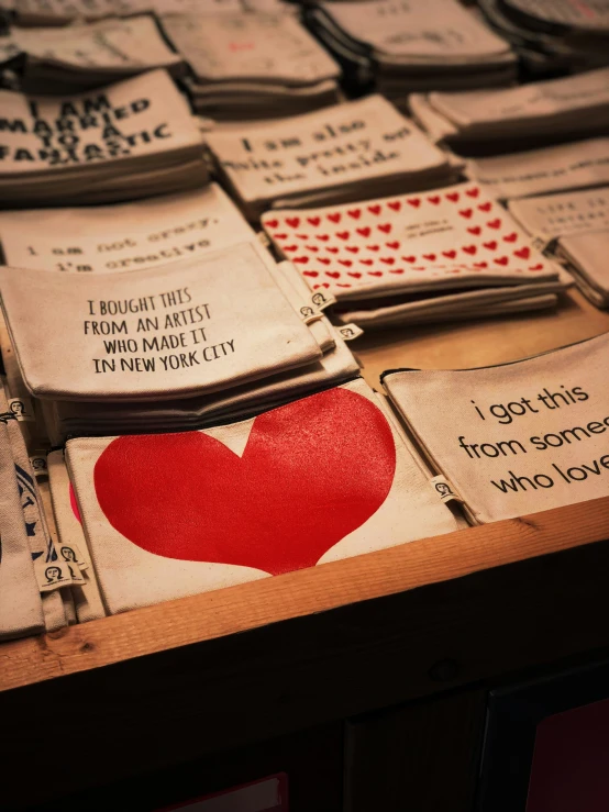 a wooden table topped with lots of playing cards