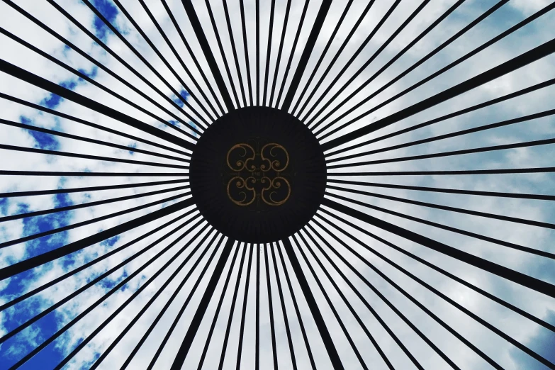 the olympic symbol on the top of an artistic structure