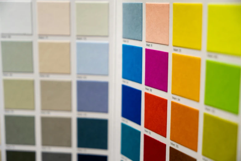 color swatches on a white wall with a black background