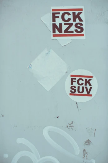 a group of stickers are on the side of a refrigerator
