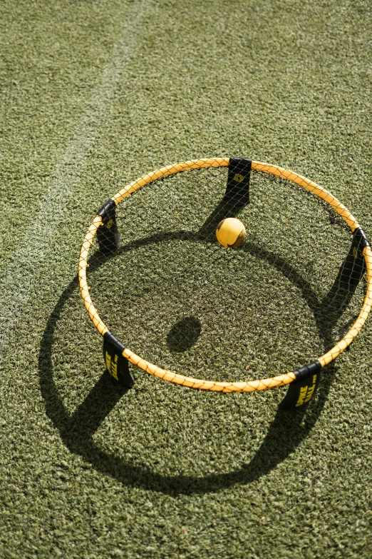 a ball is on a tennis court with some strings