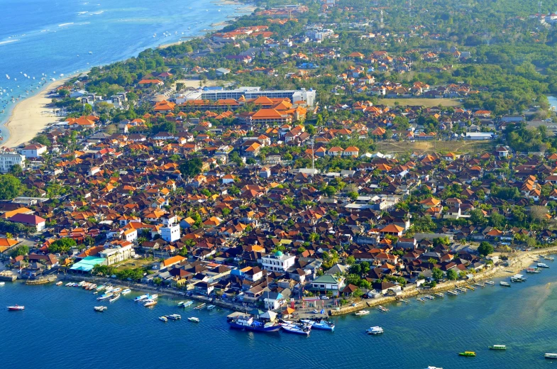 an island with many houses and buildings next to the water