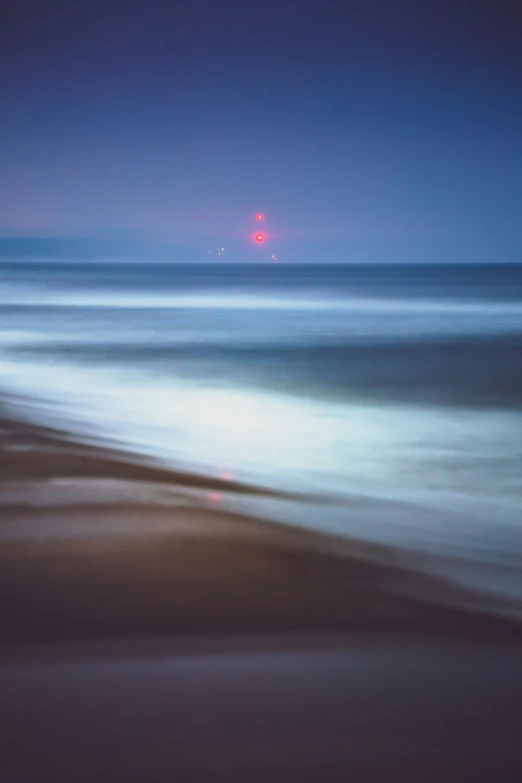 a blurred blurry po shows bright red firework