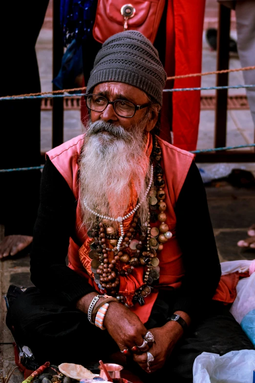 a man sitting in front of some other men