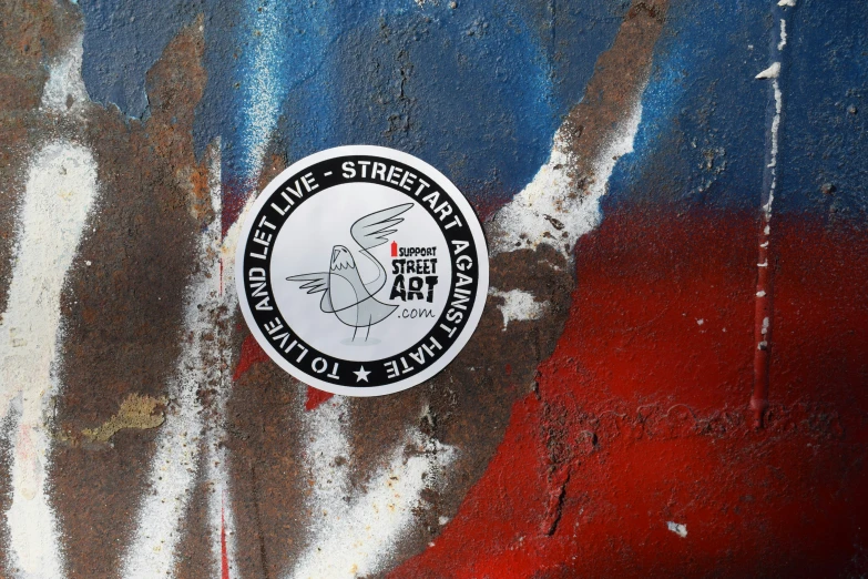 an image of graffiti and a sticker that says fine street food