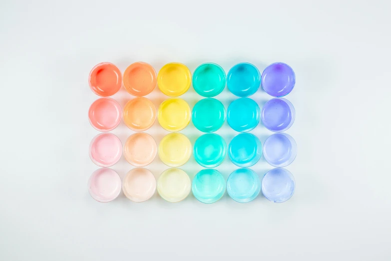 multicolored eggs are lined up in rows
