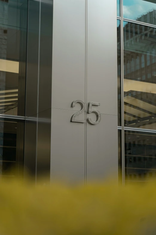 large metal number on the side of an office building