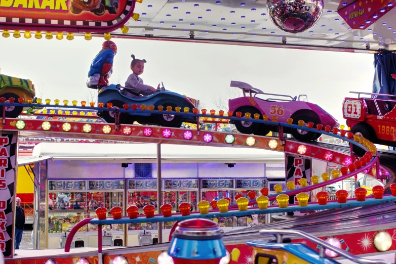 a toy car rides in a carnival ride