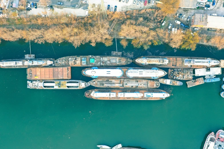 a marina full of various boats in the water