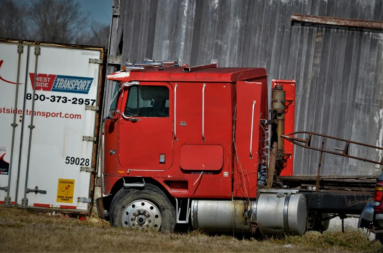 a big red truck that is in front of a building