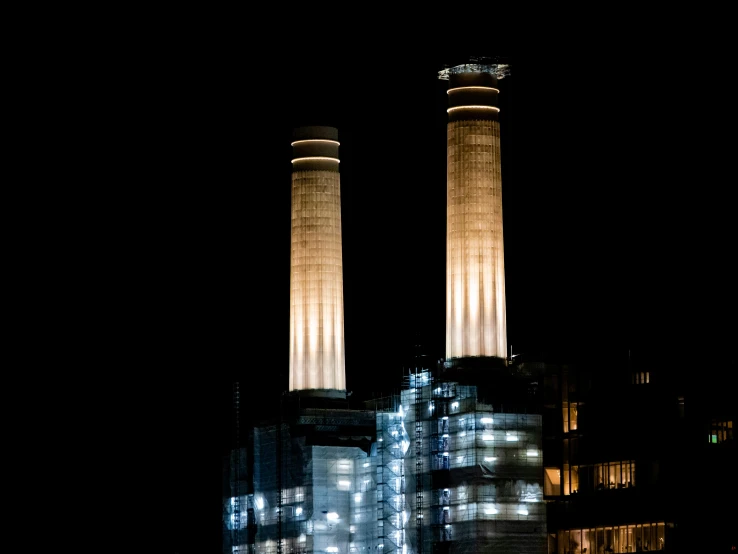 a couple of towers that are lit up in the dark