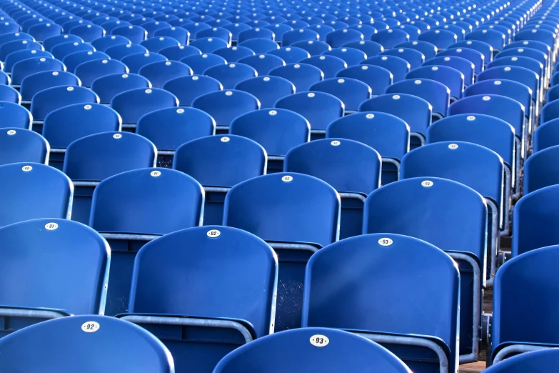 rows of blue seats with ons on them