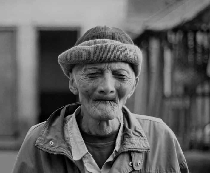 an older man sticking his tongue out