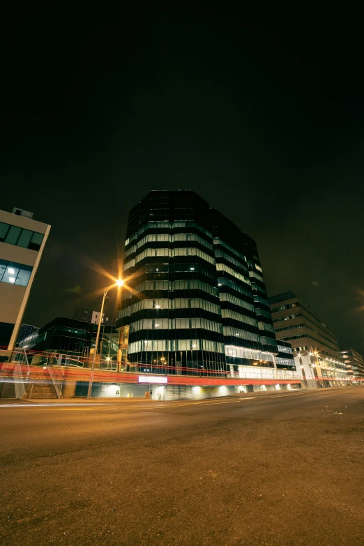 a large building near some tall buildings