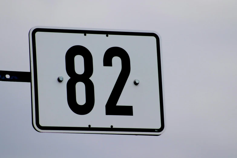 a close up of the numbers on a street sign