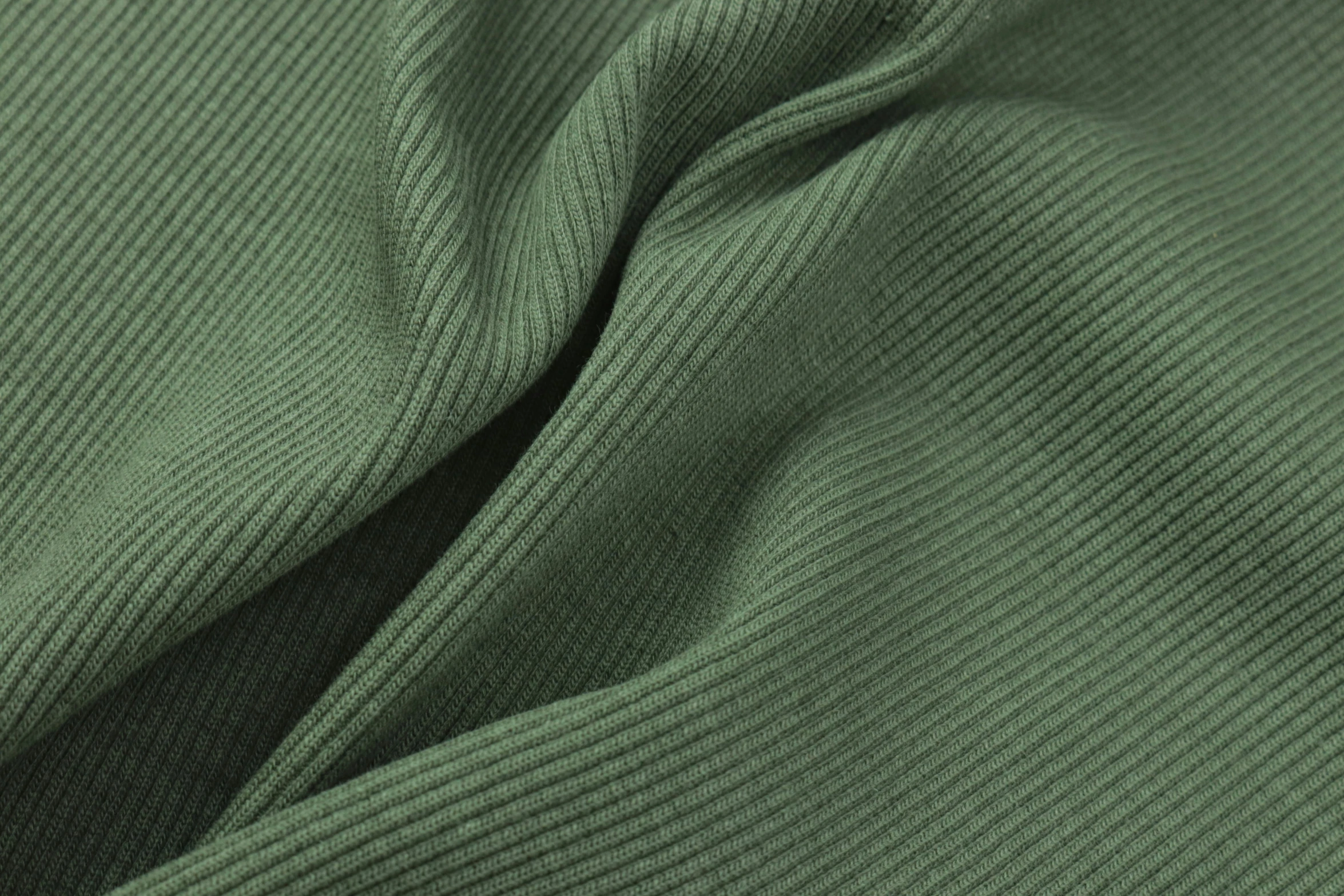 a green shirt with ons and an extended tie