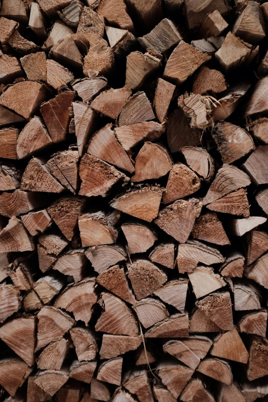 a pile of wooden logs stacked up with each other