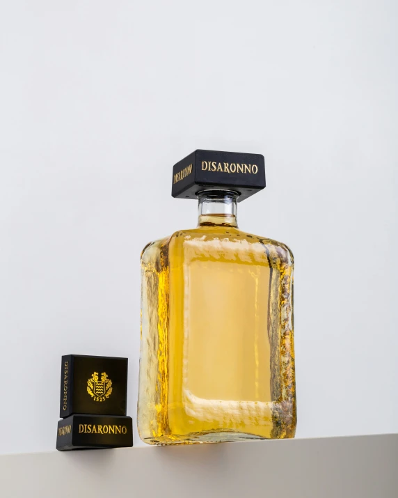 a bottle of disargonno and a card sit on a counter